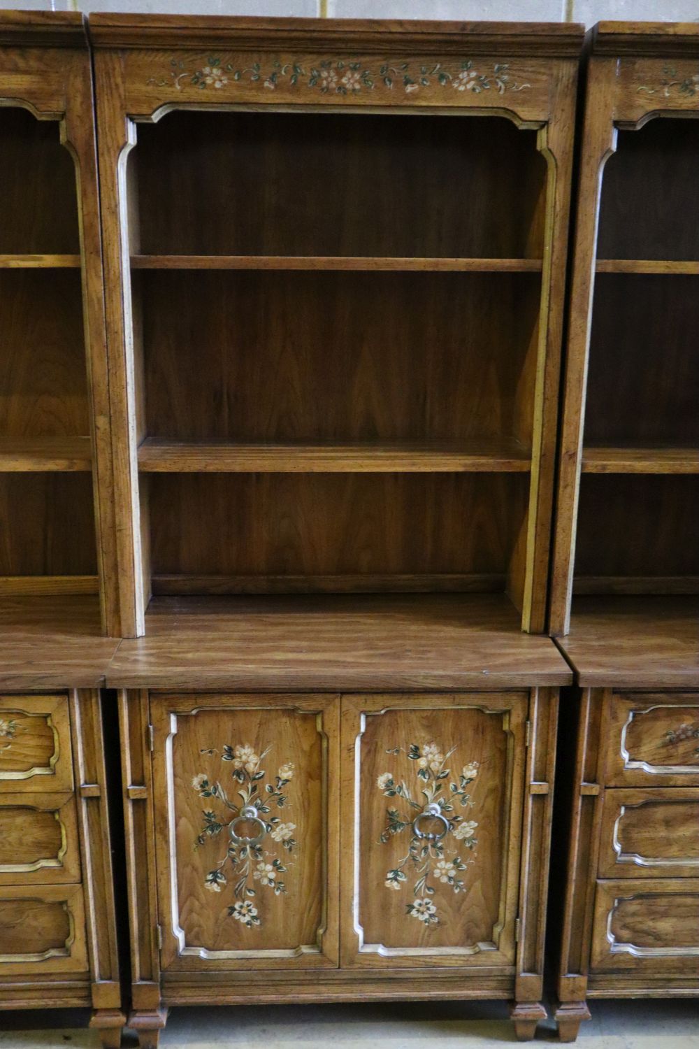 Three American stencilled walnut cabinets, total width 270cm, depth 44cm, height 181cm